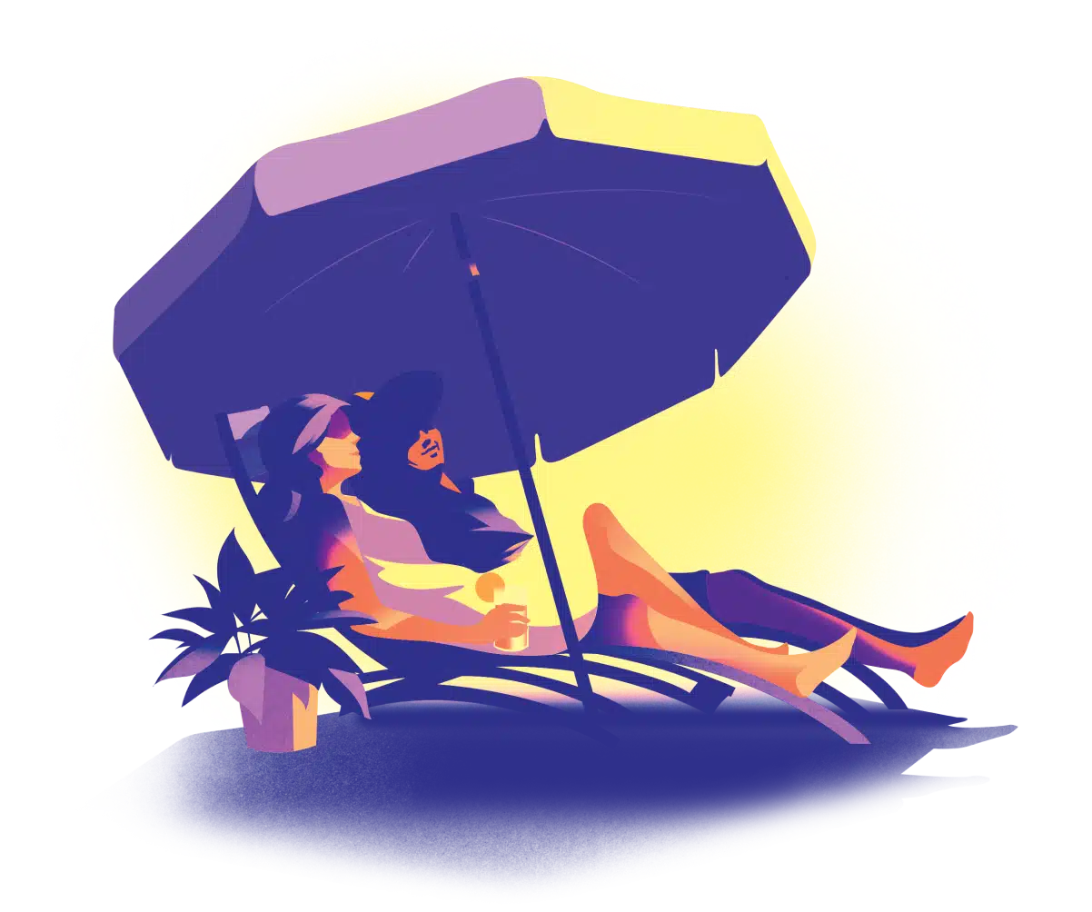 Couple sitting in beach chairs under an umbrella